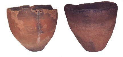 Two whole brownware pots from Owens Valley, curated at the Eastern California Museum.